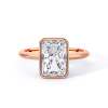 low-profile bezel set solitaire with rose gold metal and radiant shape diamond