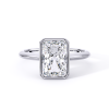 low-profile bezel set solitaire with platinum metal and radiant shape diamond