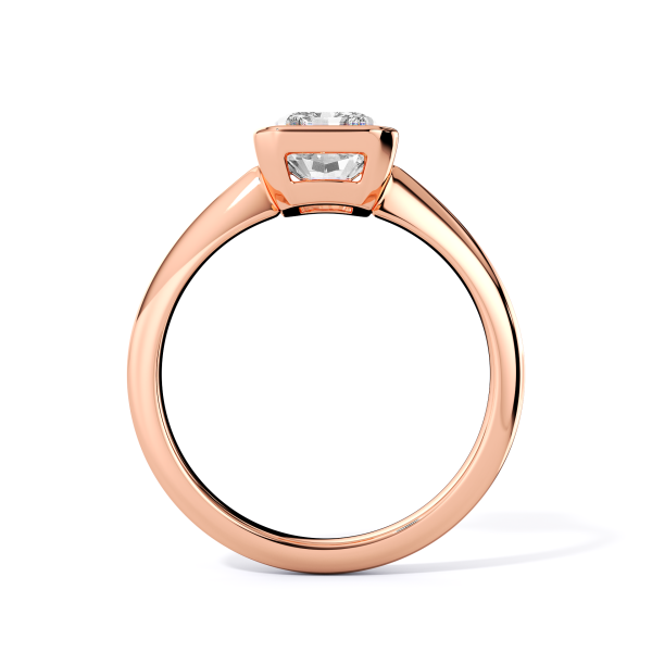 low-profile bezel set solitaire with rose gold metal and radiant shape diamond