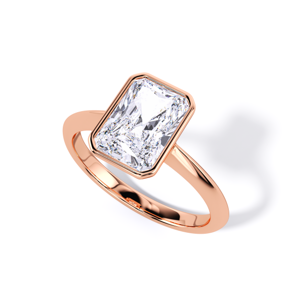 low-profile bezel set solitaire with rose gold metal and radiant shape diamond