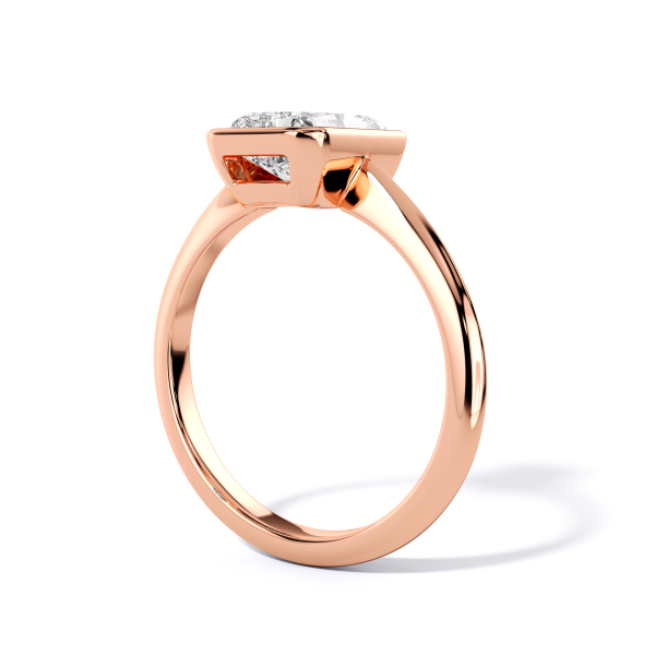 low-profile bezel set solitaire with rose gold metal and radiant shape diamond