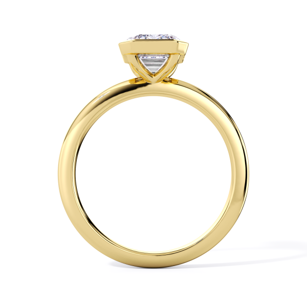 classic bezel solitaire with yellow gold metal and emerald shape diamond