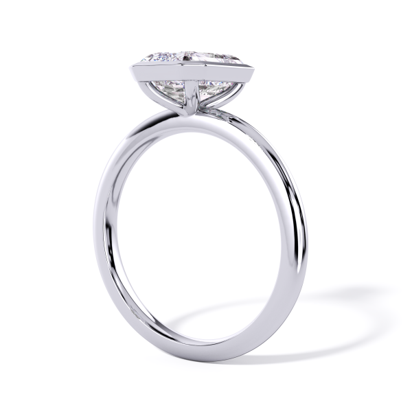 classic bezel solitaire with platinum metal and emerald shape diamond
