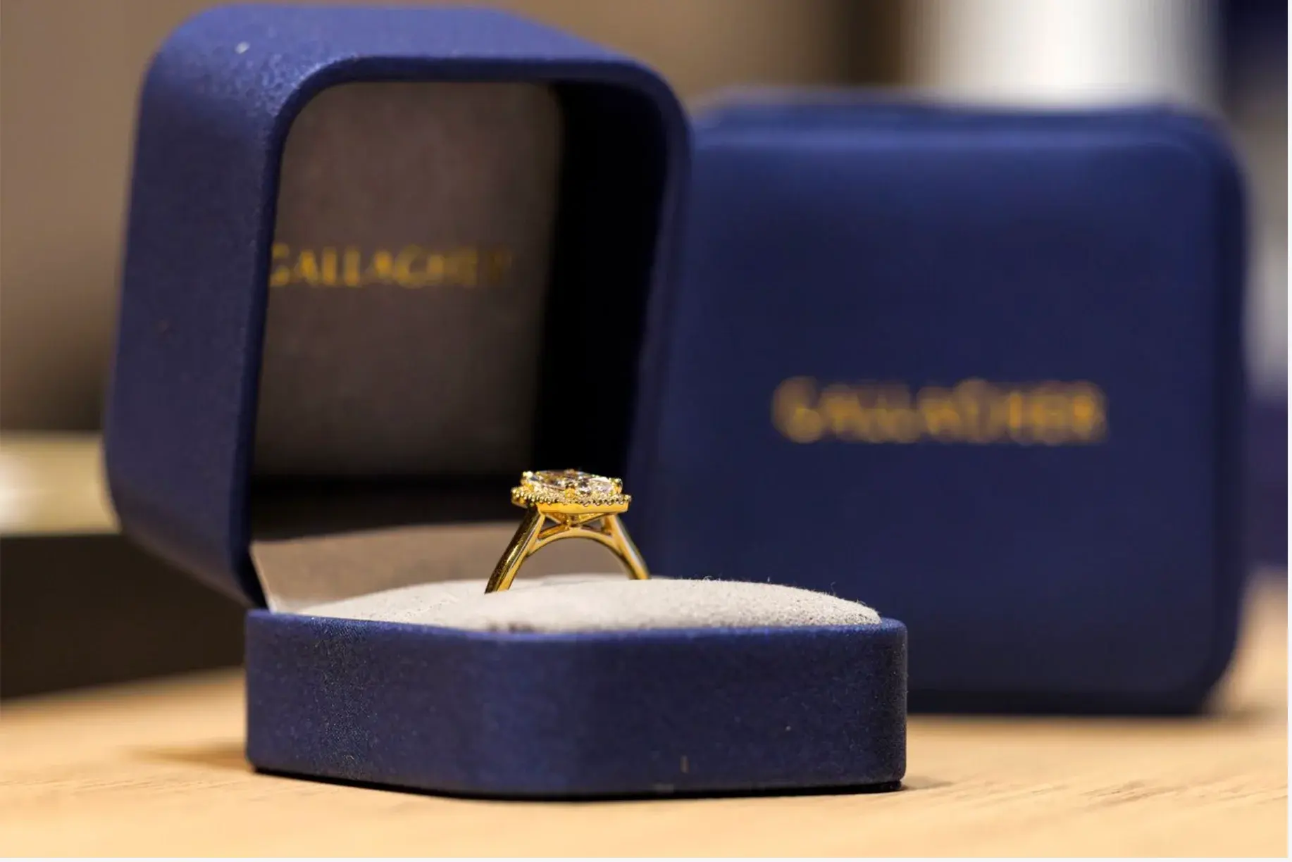 Diamond ring displayed in a blue Gallagher jewellery box